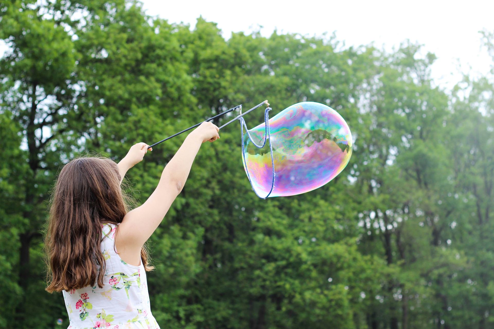 Child making bubble